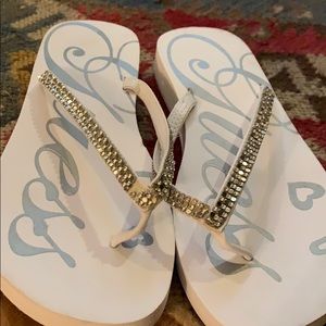 Guess brand ladies flip flops.